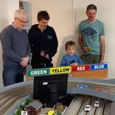 A family slot car session organised by Melton & District Model Club