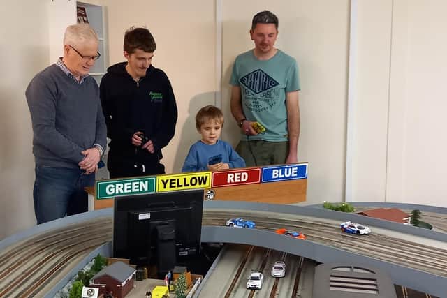 A family slot car session organised by Melton & District Model Club