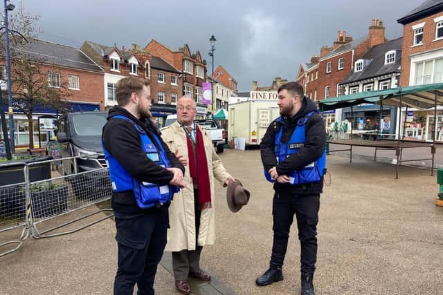 Leicestershire Police and Crime Commissioner Rupert Matthews chats to two of the private security operatives who are patrolling the town centre
