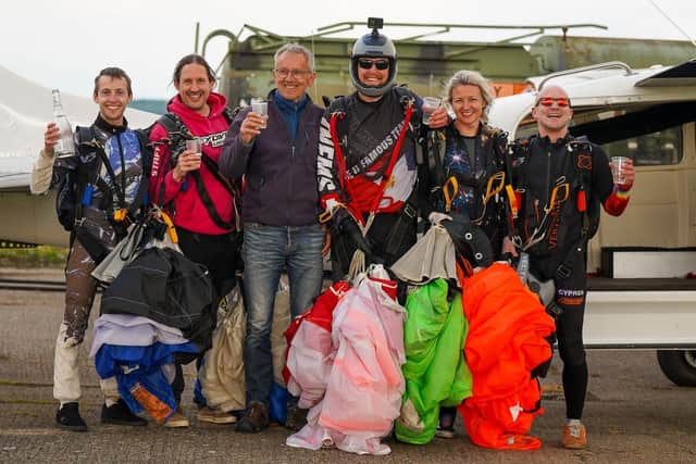 Skydiver Dan Guest celebrates setting a new British record with his support team at Skydive LangarIMAGE Jacek Roszak