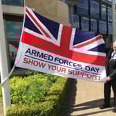 Mayor of Melton, Councillor Alan Hewson, pictured with the Armed Forces Day flag this morning