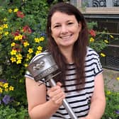 Helen Cliff holding the treasured Olympic Torch her grandfather carried in the torch relay at the 1948 London Games