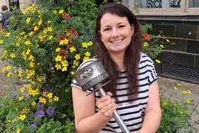 Helen Cliff holding the treasured Olympic Torch her grandfather carried in the torch relay at the 1948 London Games