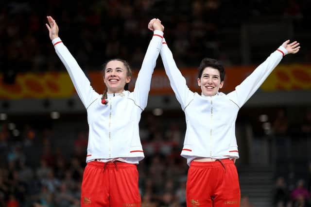 LONDON, ENGLAND - JULY 31: Silver Medalists, Georgia Holt and Sophie Unwin of Team England celebrate on the podium in the Women's Tandem B 1000m Time Trial medal ceremony on day three of the Birmingham 2022 Commonwealth Games at Lee Valley Velopark Velodrome on July 31, 2022 on the London, England. (Photo by Justin Setterfield/Getty Images)