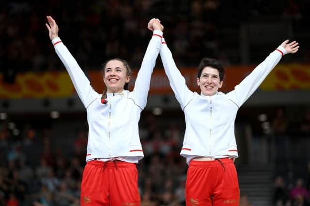 LONDON, ENGLAND - JULY 31: Silver Medalists, Georgia Holt and Sophie Unwin of Team England celebrate on the podium in the Women's Tandem B 1000m Time Trial medal ceremony on day three of the Birmingham 2022 Commonwealth Games at Lee Valley Velopark Velodrome on July 31, 2022 on the London, England. (Photo by Justin Setterfield/Getty Images)