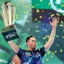 TROPHY PARADE - Luke Humphries lifts the trophy after winning the 2023/24 Paddy Power World Darts Championship final against Luke Littler. Humphries will parade his trophy at Elland Road when Leeds United host Preston North End on Sunday. Pic: Tom Dulat/Getty Images)