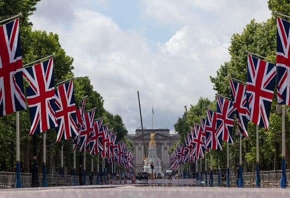 LONDON, ENGLAND - MAY 20: The Mall which has been lined with Union Flags in preparation for the Queens Jubilee, on May 20, 2022 in London, England. The Platinum Jubilee of Elizabeth II is being celebrated from June 2 to June 4, 2022, in the UK and Commonwealth to mark the 70th anniversary of the accession of Queen Elizabeth II on 6 February 1952. (Photo by Dan Kitwood/Getty Images)