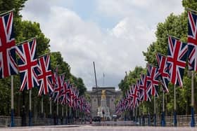 LONDON, ENGLAND - MAY 20: The Mall which has been lined with Union Flags in preparation for the Queens Jubilee, on May 20, 2022 in London, England. The Platinum Jubilee of Elizabeth II is being celebrated from June 2 to June 4, 2022, in the UK and Commonwealth to mark the 70th anniversary of the accession of Queen Elizabeth II on 6 February 1952.  (Photo by Dan Kitwood/Getty Images)