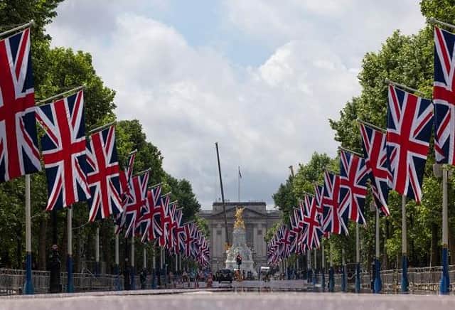 LONDON, ENGLAND - MAY 20: The Mall which has been lined with Union Flags in preparation for the Queens Jubilee, on May 20, 2022 in London, England. The Platinum Jubilee of Elizabeth II is being celebrated from June 2 to June 4, 2022, in the UK and Commonwealth to mark the 70th anniversary of the accession of Queen Elizabeth II on 6 February 1952. (Photo by Dan Kitwood/Getty Images)