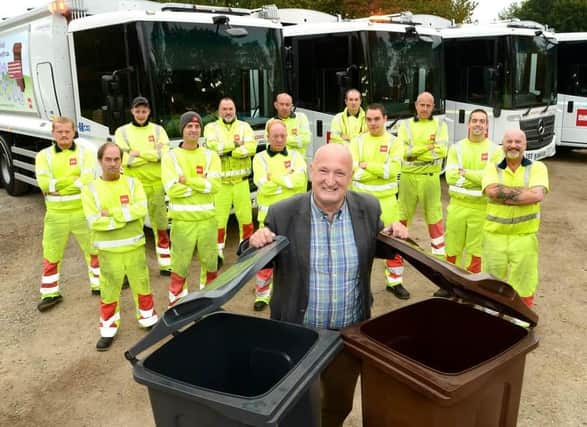 Melton Borough Council leader Joe Orson pictured with bin collection teams employed by contractor, Biffa