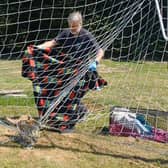 Scared fox gets trapped in goal netting...watch how he gets rescued