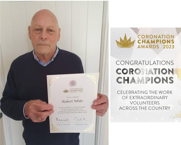 Bob White shows off his certificate after being recognised as a Coronation Champion