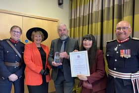 Christine Slomkowska and Patrick McCracken, of 103 The Eye, show off their King's Award at the presentation with Lord Lieutenant of Leicestershire Mike Kapur (right) and Deputy Lord Lieutenants Penny Coates and Dave Andrews