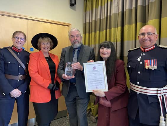 Christine Slomkowska and Patrick McCracken, of 103 The Eye, show off their King's Award at the presentation with Lord Lieutenant of Leicestershire Mike Kapur (right) and Deputy Lord Lieutenants Penny Coates and Dave Andrews