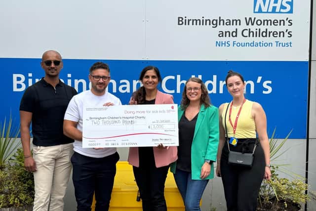 Morro Partnerships present Birmingham Children's Hospital with a cheque for £2,000
