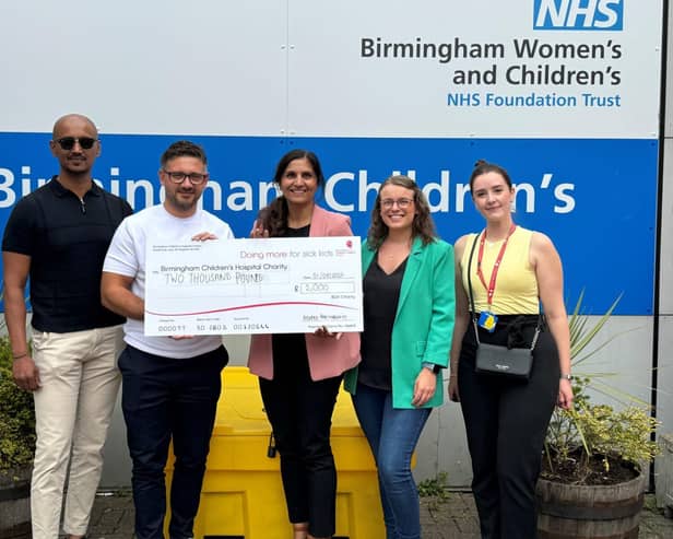 Morro Partnerships present Birmingham Children's Hospital with a cheque for £2,000