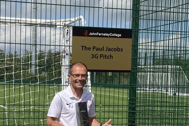 Long-serving teacher Paul Jacobs at the new 3G pitch has been named after him