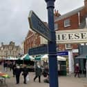 The historic street market in Melton Mowbray - bright new canopies will be used as part of a town centre overhaul