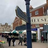 The historic street market in Melton Mowbray - bright new canopies will be used as part of a town centre overhaul