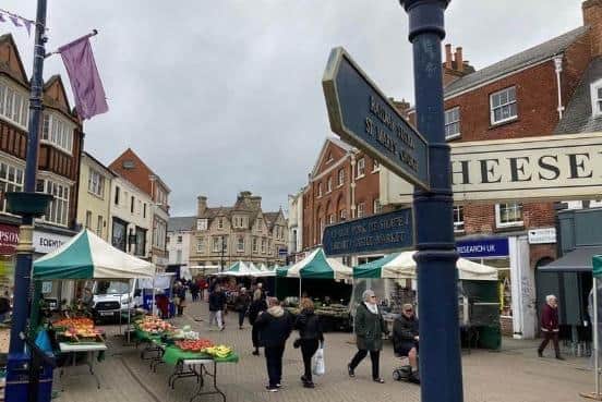 The historic street market in Melton Mowbray - bright new canopies will be used as part of a town centre overhaul