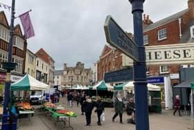 The historic street market in Melton Mowbray - bright new canopies will be used as part of a town centre overhaul