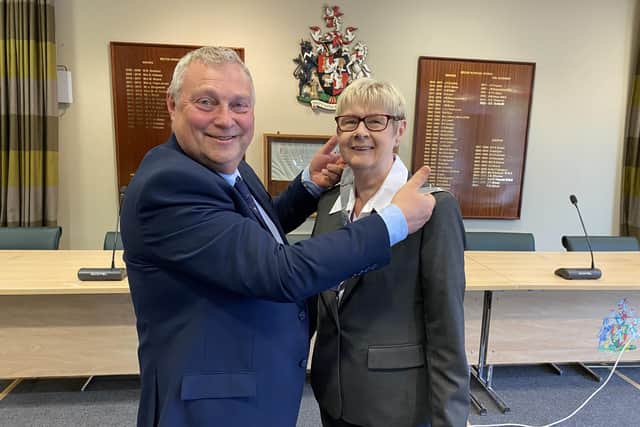 New Mayor of Melton, Councillor Siggy Atherton, is presented with the chains of office by outgoing Mayor, Councillor Tim Webster