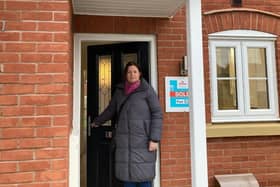 Councillor Butcher outside Melton Council's new house in the town