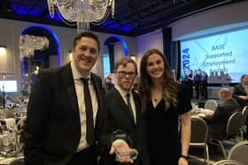 Ed and the team after receiving their award