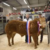 JB Thompson of Stainby are presented with The Brownlow Challenge Cup, for Champion Beast last year's Melton Fatstock Show, by the Mayor of Melton, Councillor Alan Hewson, Melton & Belvoir Agricultural Society chair, Hugh Brown, and auctioneer, Scott Ruck