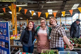 Some of the team at Melton's Pepper's - A Safe Place promote their activities on a market stall