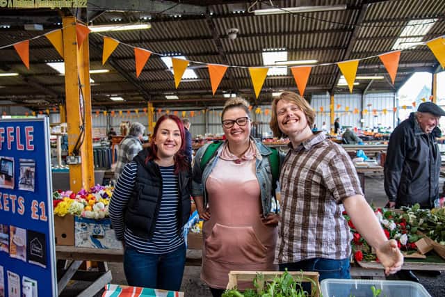 Some of the team at Melton's Pepper's - A Safe Place promote their activities on a market stall