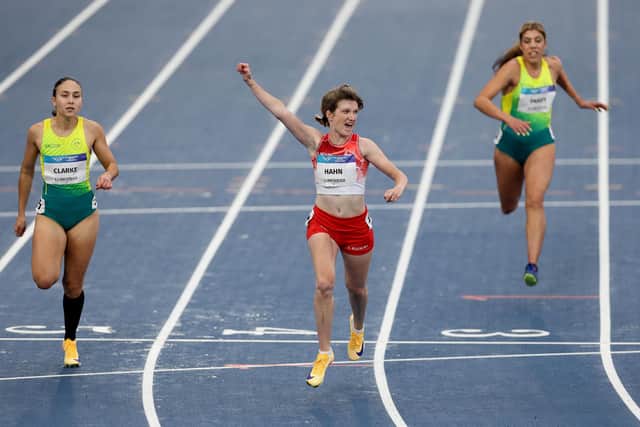 Sophie Hahn of Team England celebrates as she crosses the finish line to win the Women's 100 Metres T38 Final (Photo by Lintao Zhang/Getty Images)