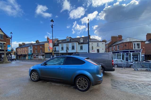 Vehicles parked on Market Place, Melton, this week, despite barriers being installed to stop them