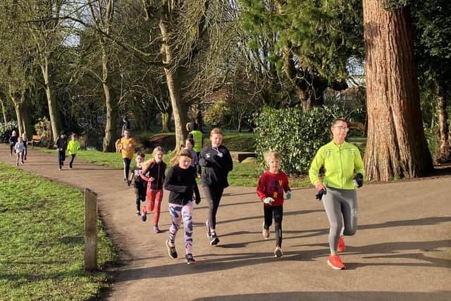 Runners, and some parents, run around the Melton Mowbray Junior Parkrun course this morning