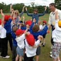 Darren Bicknell with youngsters at a recent session organised by The Belvoir Education & Sports Trust