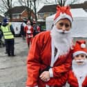 Sara Wilson-Wright and her daughter Isabelle pictured at the start of Sunday's Melton Santa Fun Run in the country park