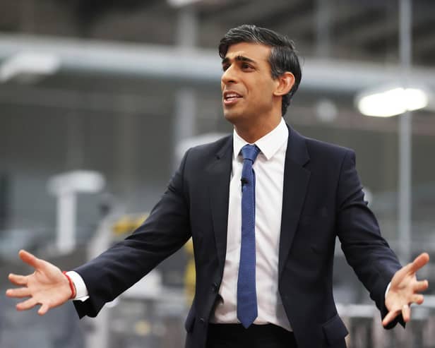 Rishi Sunak talks to local business leaders during a visit to a Coca-Cola factory in Lisburn, Northern Ireland yesterday (Picture: Liam McBurney/WPA pool/Getty Images)