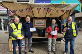 Members of the local Liberal Democrats, Labour and Green Party man a stall in Melton's Market Place to highlight changes to voter ID regulations for the upcoming local elections