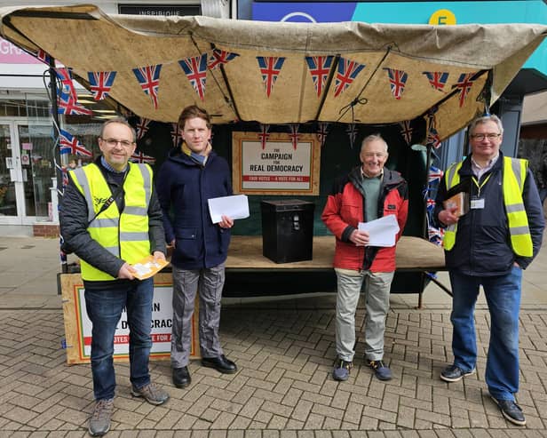 Members of the local Liberal Democrats, Labour and Green Party man a stall in Melton's Market Place to highlight changes to voter ID regulations for the upcoming local elections