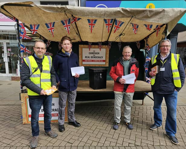 Members of the local Liberal Democrats, Labour and Green Party man a stall in Melton's Market Place to highlight changes to voter ID regulations for the upcoming local elections