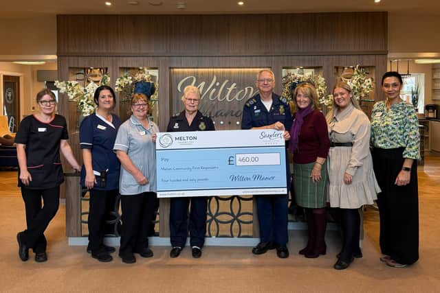 Melton First Responders are presented with a cheque following the family fun day at Wilton Manor luxury care home