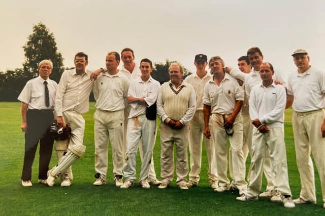 Baz Cousins (holding bottle) with team mates at a cricket match