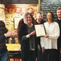 The Evans family at the Stilton Cheese pub, at Somerby, are presented with their CAMRA award