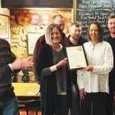 The Evans family at the Stilton Cheese pub, at Somerby, are presented with their CAMRA award