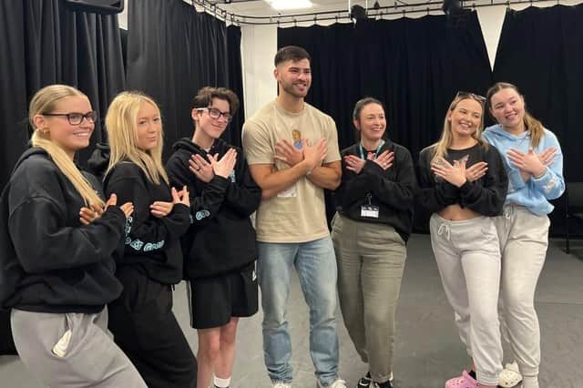 Owen Warner pictured with performing arts students on his return to SMB College Group's Melton campus