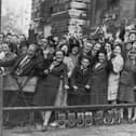 Crowds at Downing Street, London, cheer prime minister Clement Attlee after the surrender of Japan in August 1945.    (Photo by Keystone/Getty Images)