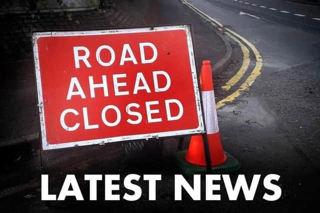 The road remains closed
