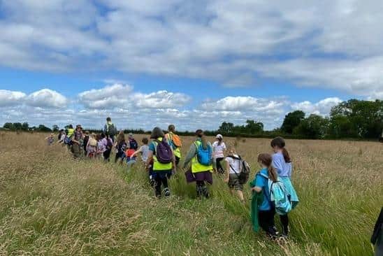 Long Clawson Primary School pupils pictured doing their 10-mile fundraising walk