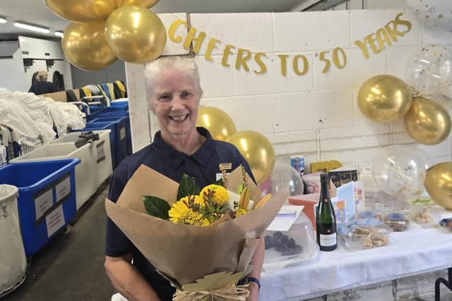 Carol Bowes pictured after being surprised with flowers and gifts after clocking up 50 years working at Ragdale Hall Spa