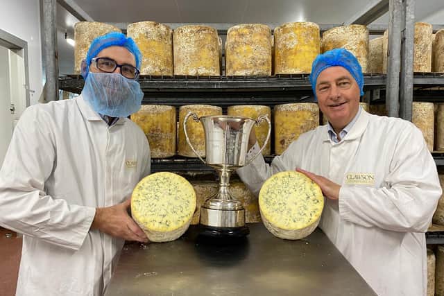 Production manager Steve Smith (left) and Kim Kettle, the farm sustainability and liaison director, pictured at Long Clawson Dairy with the trophy the firm recently won as supreme champion at the International Cheese and Dairy Awards.for their Blue Stilton